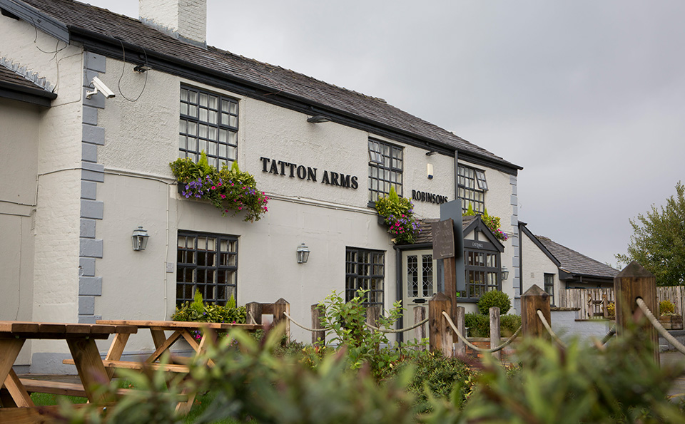 External picture of the Tatton Arms pub and restaurant with beer garden near Manchester Airport and Wythenshawe